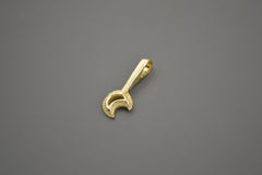 14k yellow gold moon wand pendant. The crescent moon shape sits at the end of a textured wand. Side view where you can see the bail at the end of the wand handle.