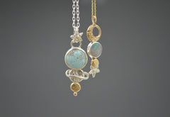 celestial pendants in mixed metal hanging next to each other