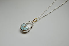 Light blue crescent shaped sand hill turquoise pendant with twisted wire and 18k gold bail