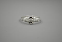 Dog Ring in sterling silver. features a dog nose and mouth with its tongue out. On gray background.