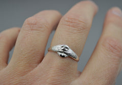 Dog Ring in sterling silver. features a dog nose and mouth with its tongue out. On hand.