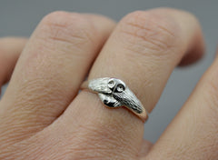 Dog Ring in sterling silver. features a dog nose and mouth with its tongue out. On hand.