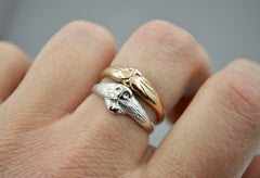 Dog and Cat Ring stacked on each other on a hand. Cat Ring is rose gold and Dog Ring is in sterling silver on the bottom.