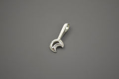 Sterling Silver moon wand pendant. The crescent moon shape sits at the end of a textured wand. Side view where you can see the bail at the end of the wand handle.