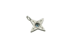 four pointed silver star pendant with a medium blue colored rose cut Montana sapphire at the center. 