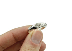 Eye shaped Ring with textured iris and white sapphire gemstone pupil. Sterling Silver.