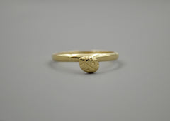 14k Gold Band with a ladybug sitting on it