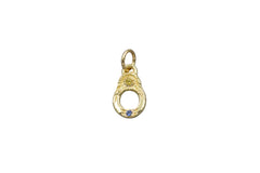 Gold pendant with yellow and blue sapphires on white background
