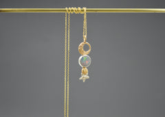 14k and sterling silver Mixed metal celestial pendant necklace with Australian opal, gold crescent moon, planet, and silver star detail