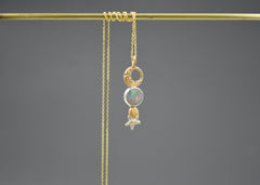 14k and sterling silver Mixed metal celestial pendant necklace with Australian opal, gold crescent moon, planet, and silver star detail