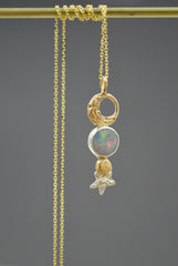 14k and sterling silver Mixed metal celestial pendant necklace with Australian opal, gold crescent moon, planet, and silver star detail