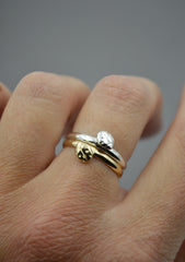 Gold and Silver ladybug ring bands worn stacked together on a finger