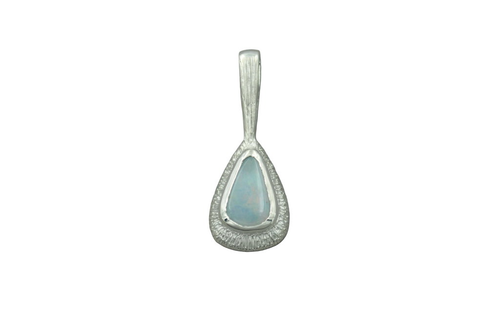 Teardrop-shaped pendant with a light blue gemstone on a white background