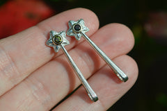 two Silver and 14k star wand pendants with a dark green tourmaline gemstone on fingertips