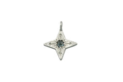 four pointed silver star pendant with a medium blue colored rose cut Montana sapphire at the center. 