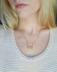 Mountain Necklace in gold on model