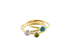 Thin gold stacking rings with gemstones
