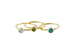 Thin gold stacking rings with gemstones