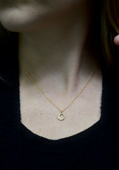 gold little moon necklace on