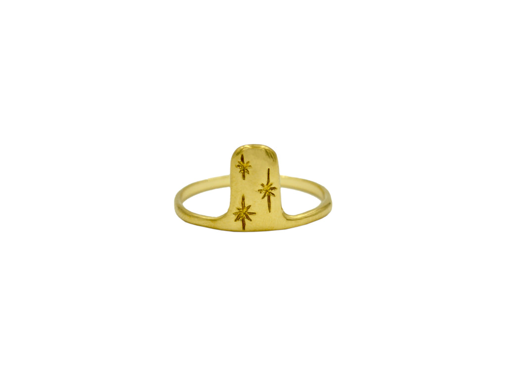 gold tone ring with three stars on it